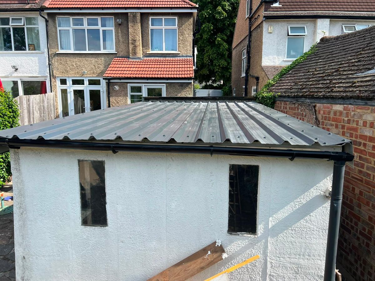 Completed corrugated metal replacement roof on Croydon garage — aerial view