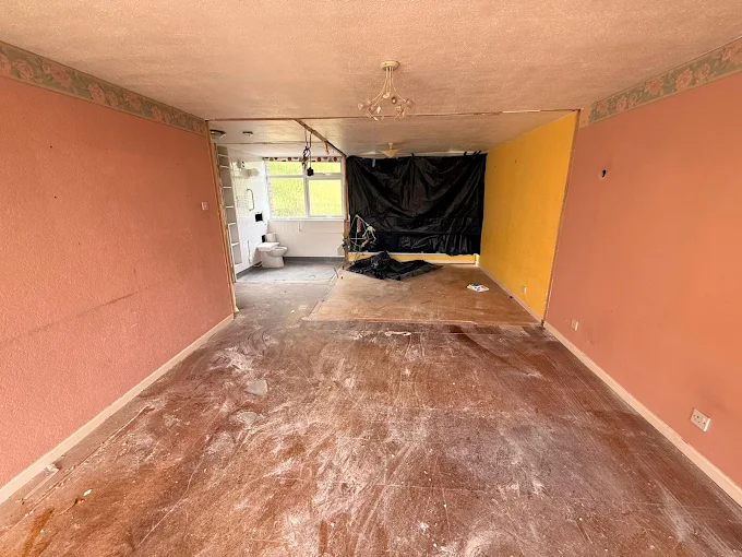 Room stripped out during commercial asbestos floor tile removal