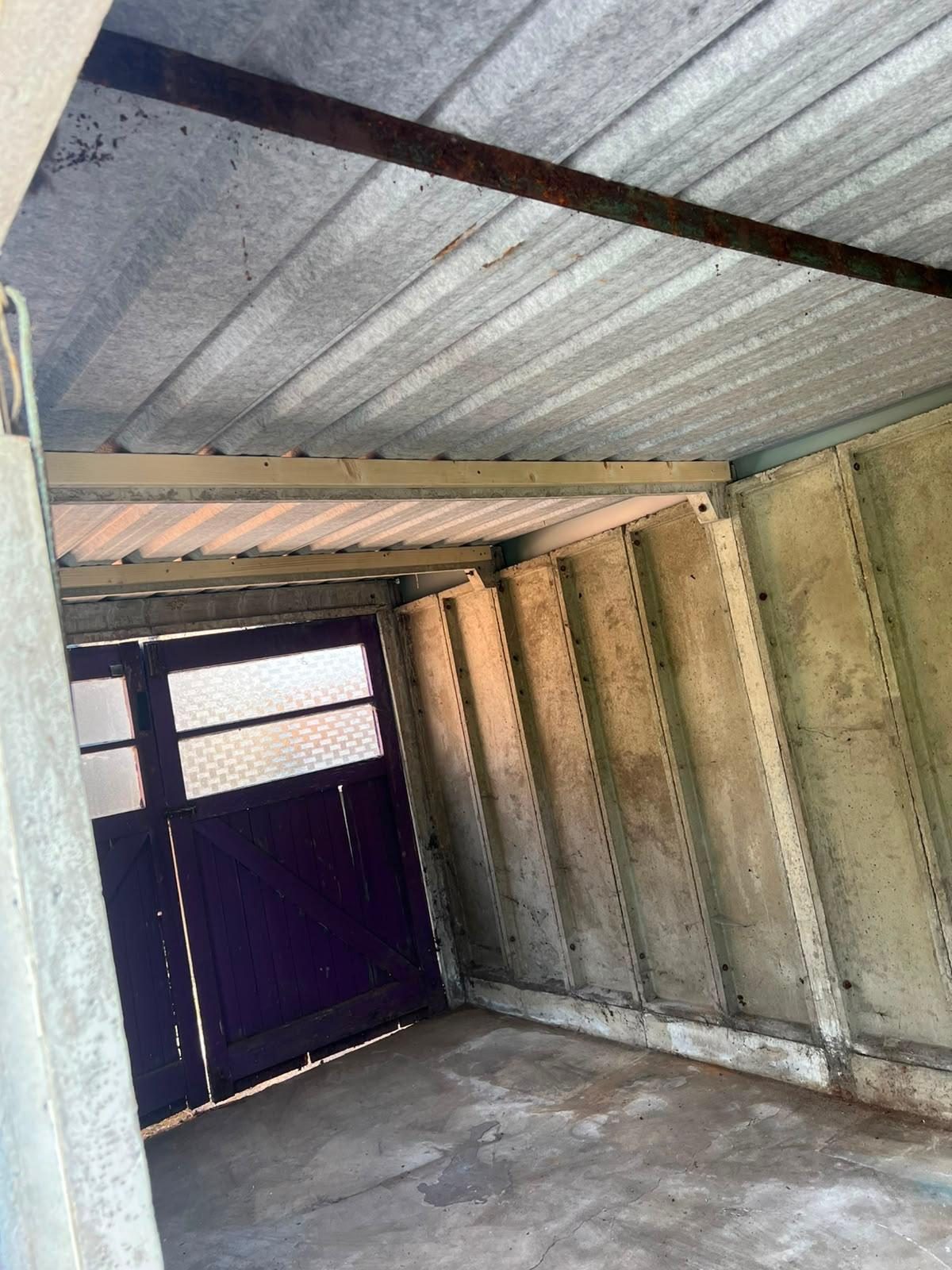 Interior view of original asbestos cement corrugated roof inside a Croydon garage — before removal